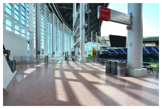 The entrance to a stadium featuring a signage board on top of sleek commercial flooring systems.