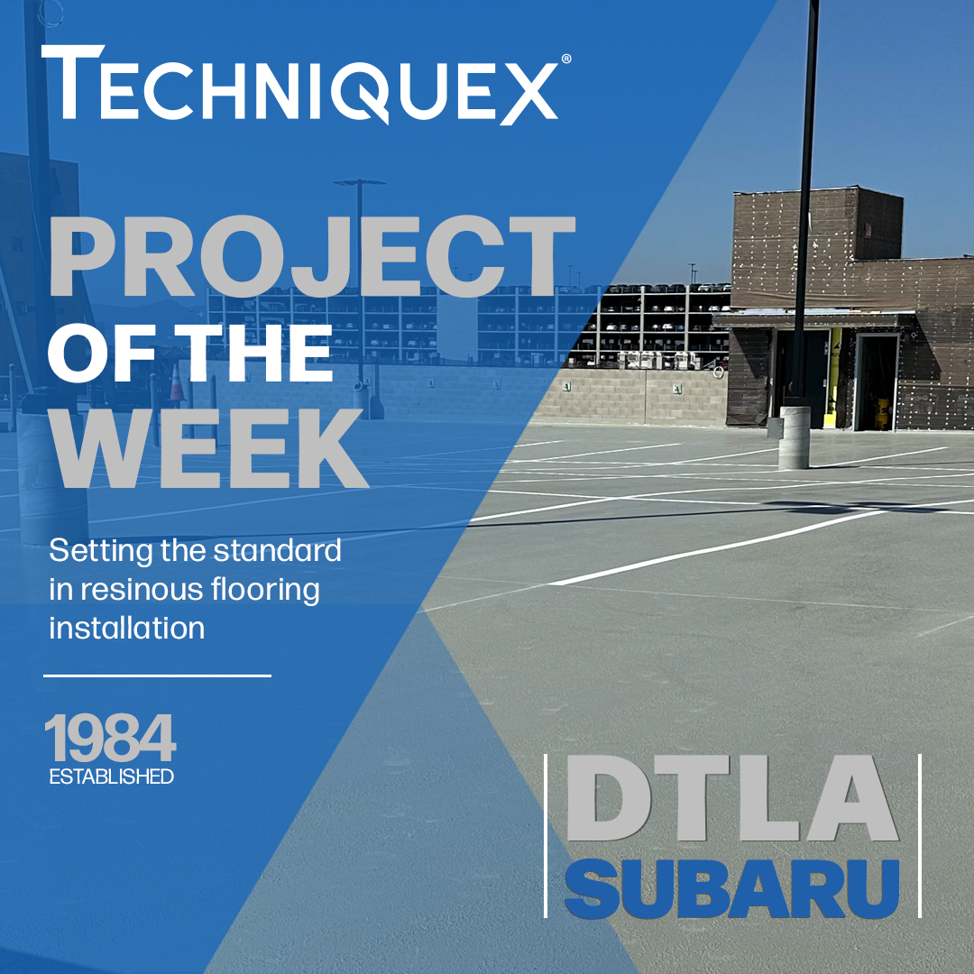 Empty parking lot with new resinous flooring near a modern building, overlaid with "Techniquex Project of the Week: DTLA Subaru" and text about flooring installation standards.