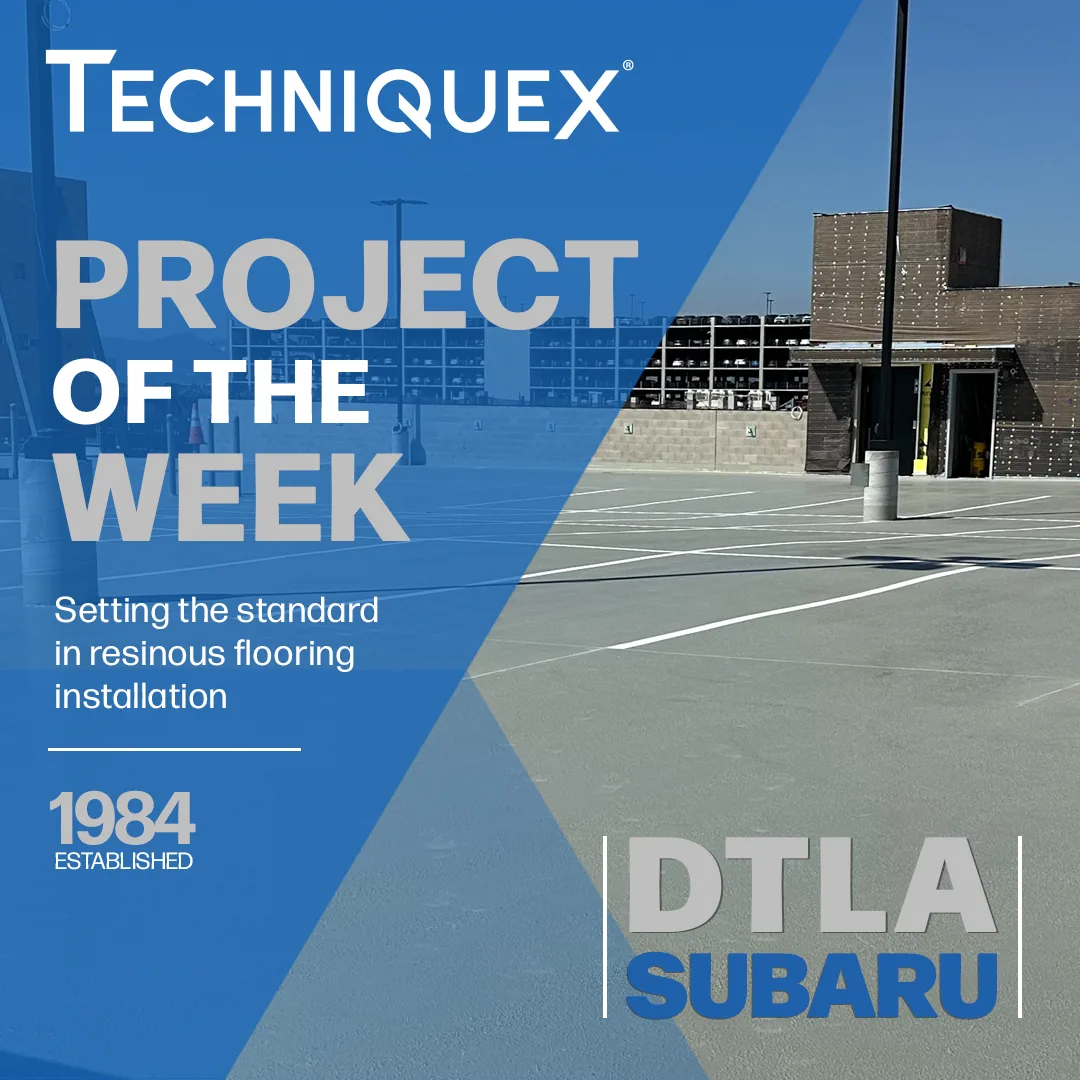 Empty parking lot with new resinous flooring near a modern building, overlaid with "Techniquex Project of the Week: DTLA Subaru" and text about flooring installation standards.