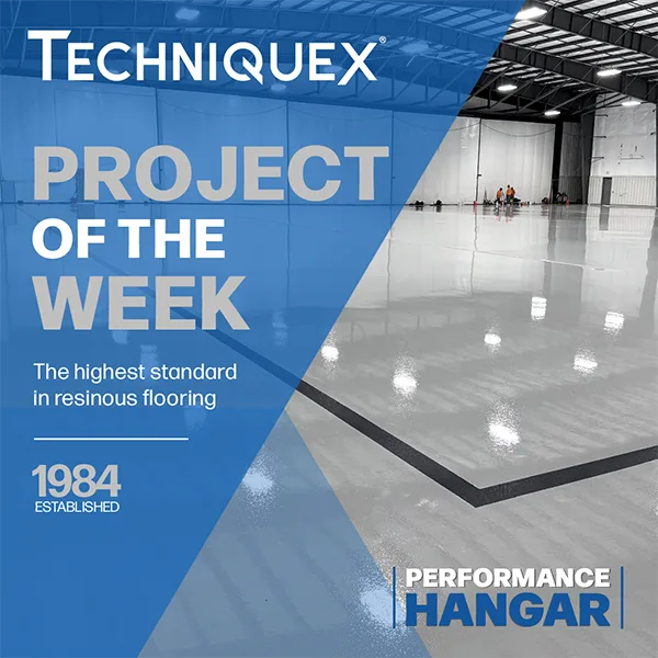 A large, glossy resinous floor in an industrial hangar, with text highlighting TechniqueX's project of the week in performance flooring.