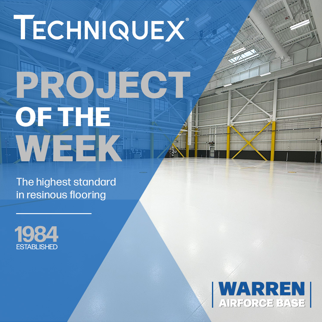 A large, clean aircraft hangar with white resinous flooring is featured as the "Project of the Week" for Techniquex at Warren Air Force Base.