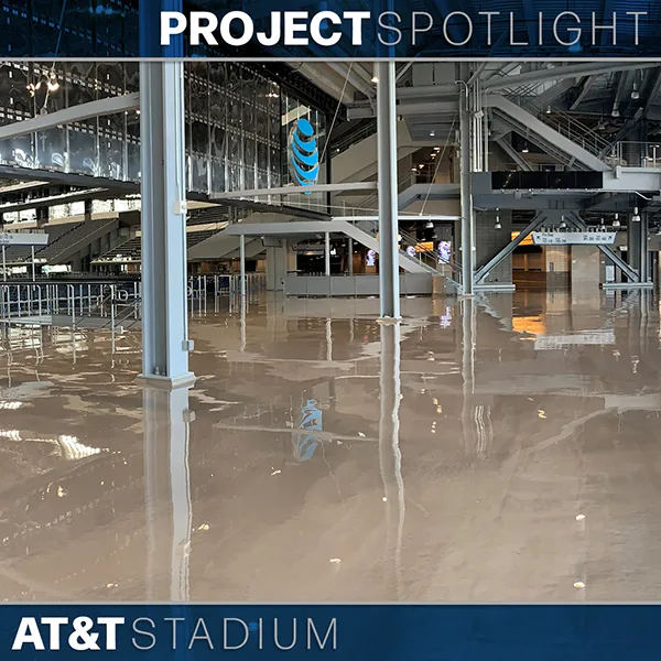 Interior view of AT&T Stadium showing polished concrete floors, steel beams, and open space under bright lighting, with "Project Spotlight" text overlay at the top.