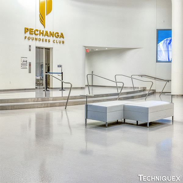 Lobby area with white benches, railings, and an entrance labeled "Pechanga Founders Club" on the wall in the background.