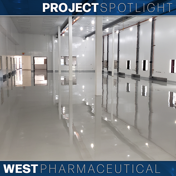 Large, empty, clean industrial facility with glossy floors, white walls, and ceiling lights. Text overlay reads “Project Spotlight: West Pharmaceutical.”.