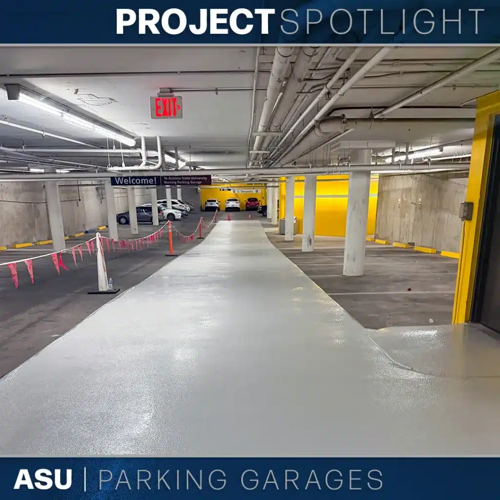 A view of a freshly painted light gray ramp inside a parking garage, featuring a “Welcome” sign for the Arizona State University Nursing Parking Garage and a red exit sign overhead.