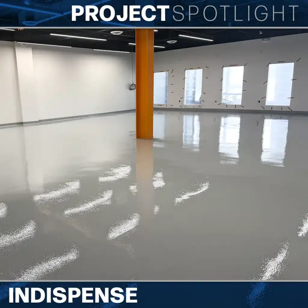 An empty room with a glossy gray floor and a single orange support pillar under the text “PROJECT SPOTLIGHT” and “INDISPENSE.”